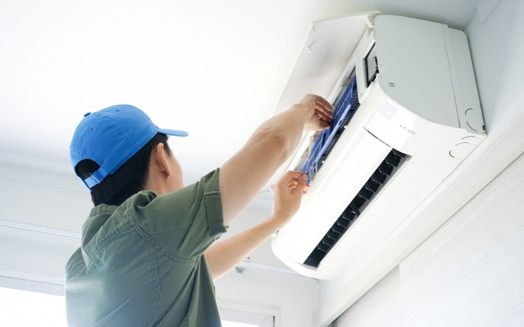 HVAC technician servicing a ductless mini split in Irvine