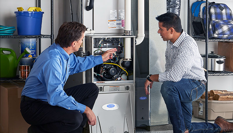 Technician evaluating a furnace for repair or replacement in Irvine