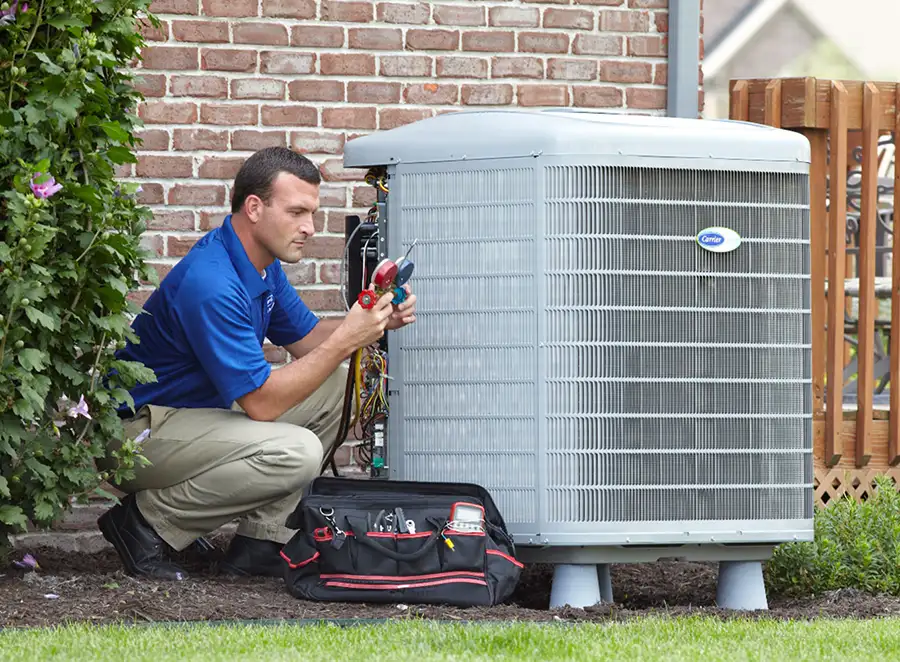 HVAC technician inspecting an outdoor AC unit in Irvine