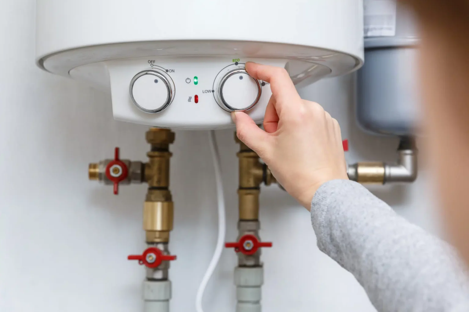 Technician adjusting a water heater in Irvine